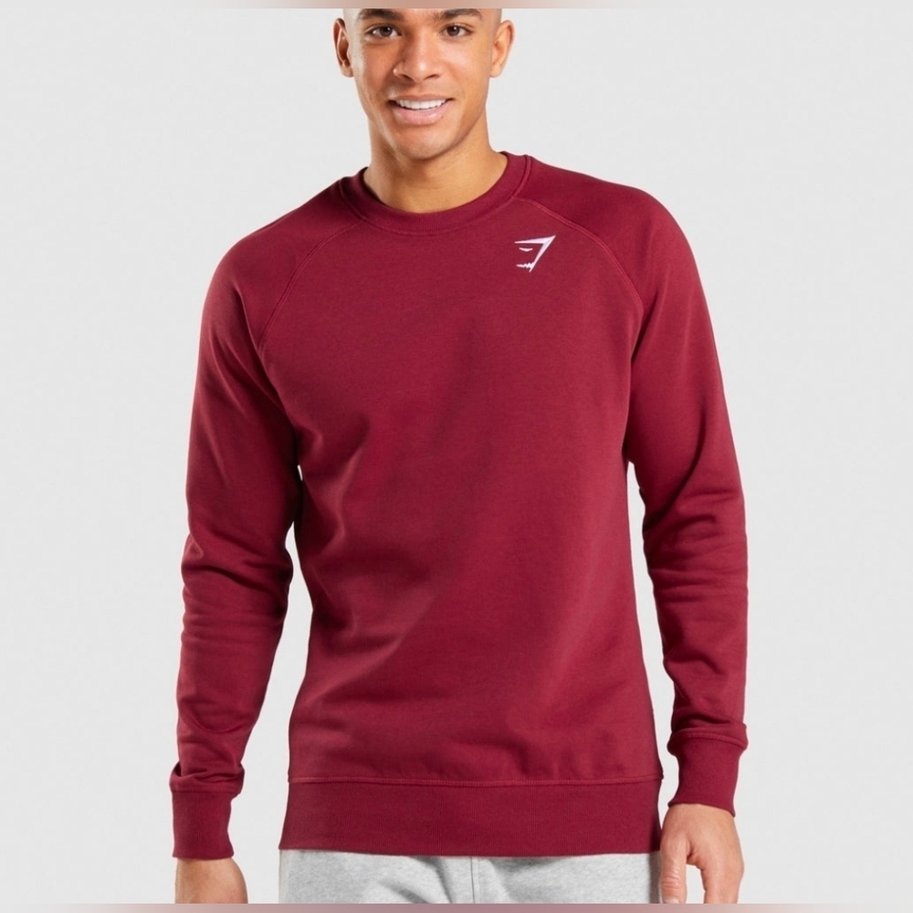 Gymshark Crest Sweatshirt in burgundy. 